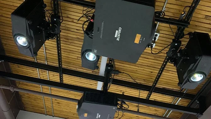 Multiple Christie Digital projectors mounted to a ceiling